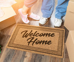 Welcome home mat with feet